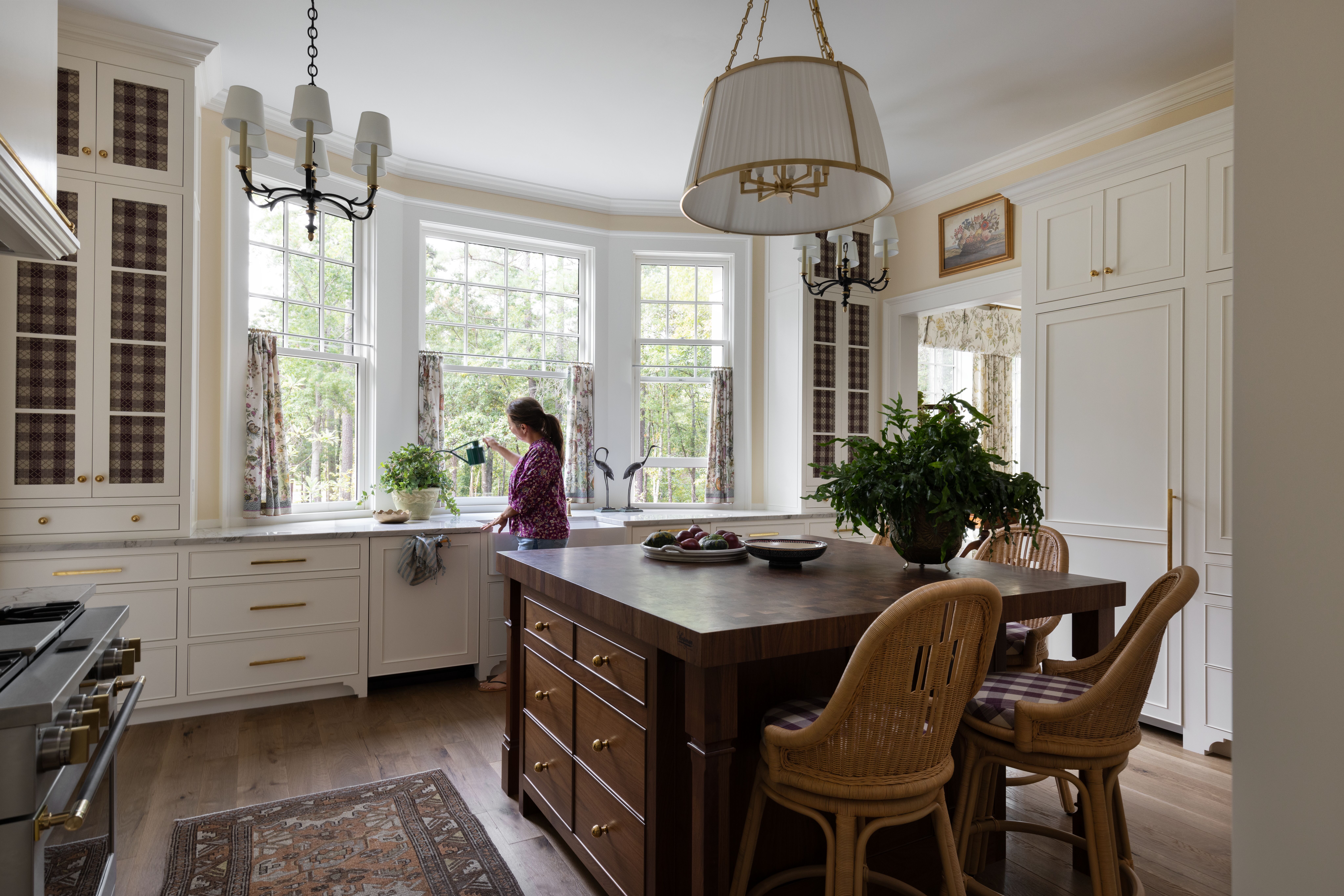 Elegant dining room with a grand chandelier and white seating in Oklahoma City, OK